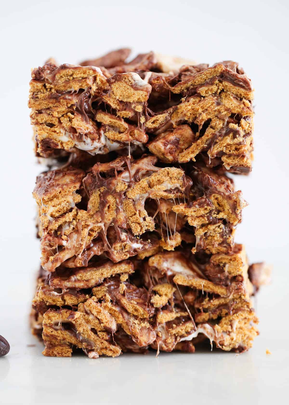 These no-bake Golden Graham bars are ready in 15 minutes and taste exactly like the classic s'mores without the need for a campfire! Stack of golden graham bars.