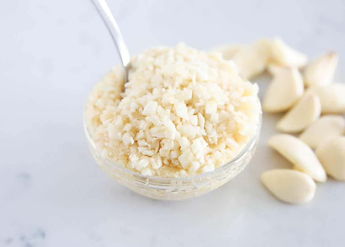 minced garlic in glass bowl