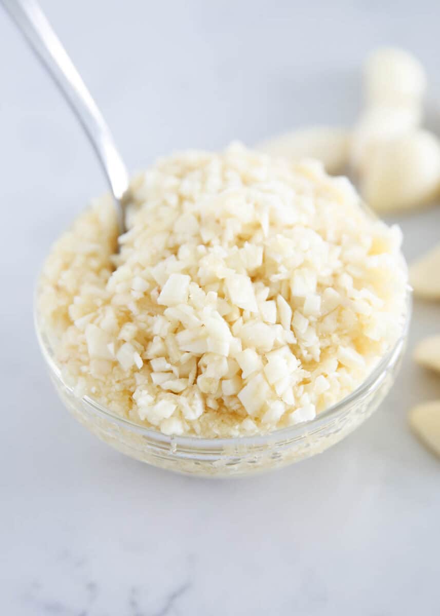 minced garlic in glass bowl