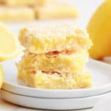 stacked lemon bars on white plate