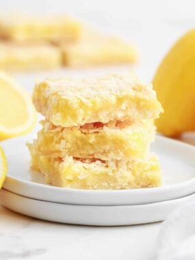 stacked lemon bars on white plate