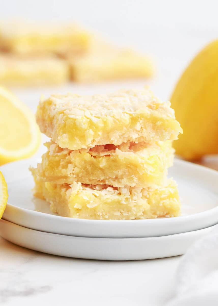 stacked lemon bars on white plate