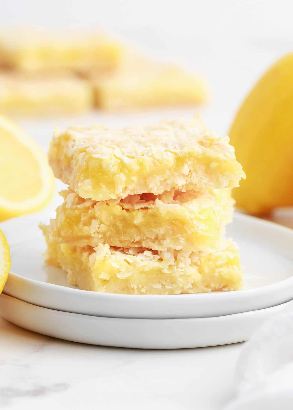 stacked lemon bars on white plate