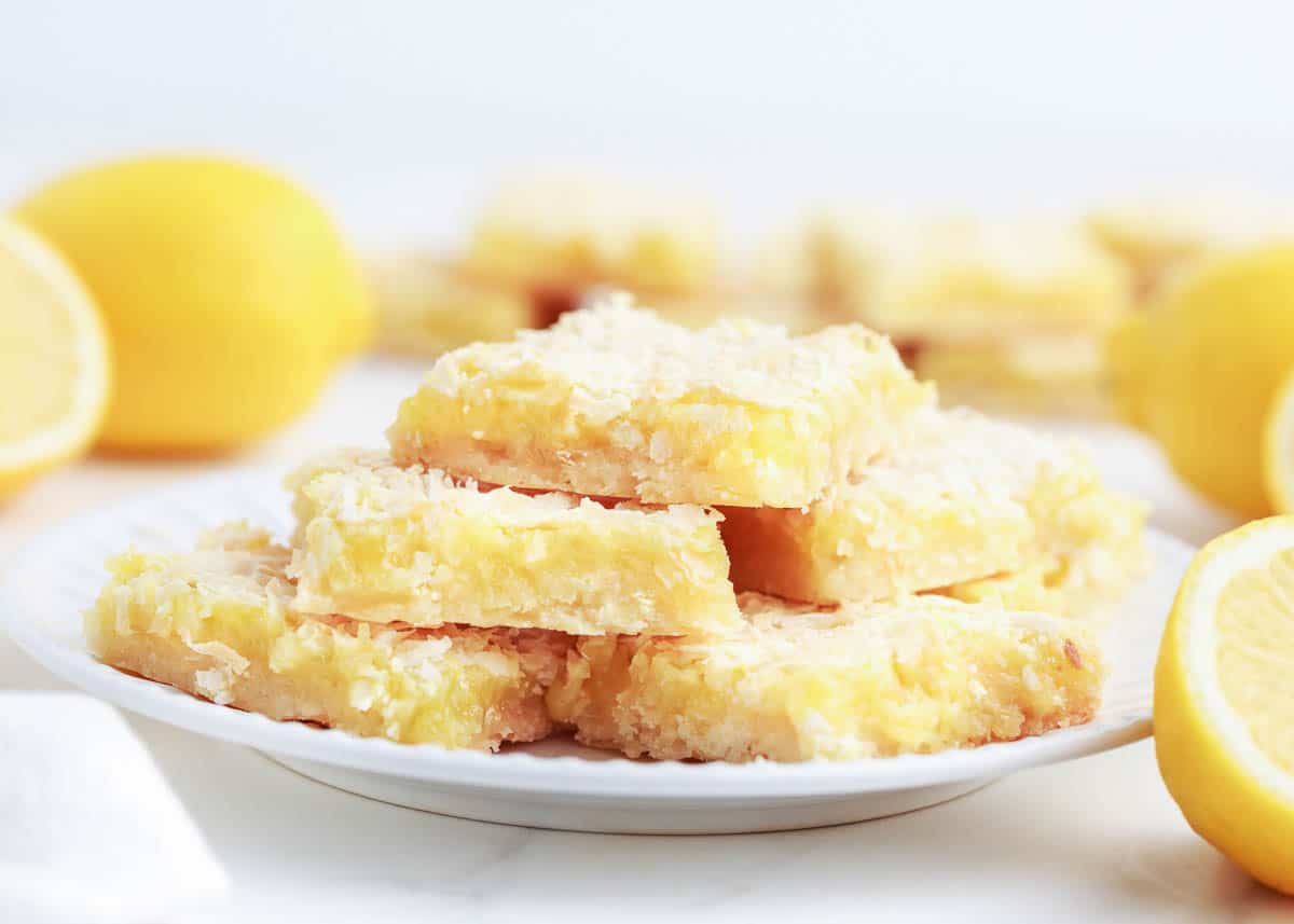 stacked lemon bars on white plate