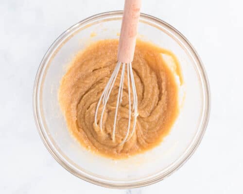 whisking peanut butter in bowl