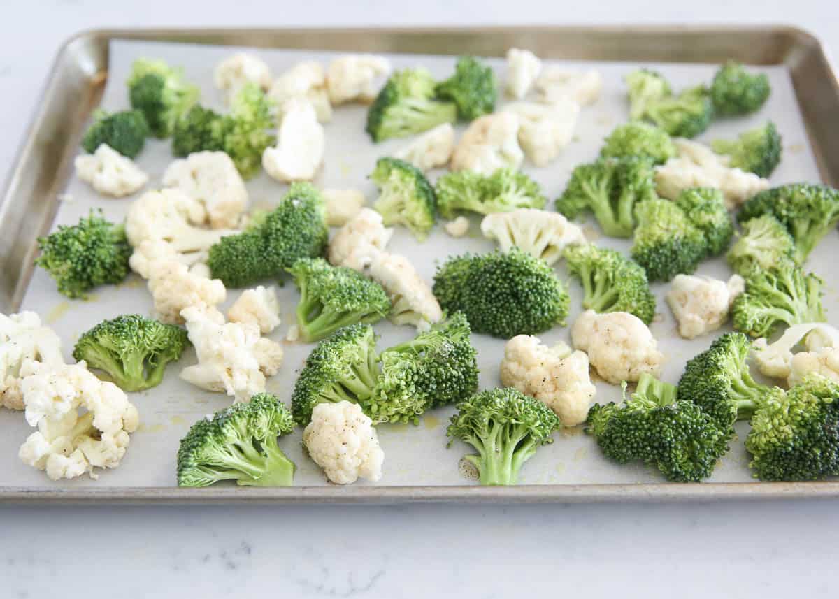 broccoli and cauliflower on baking sheet