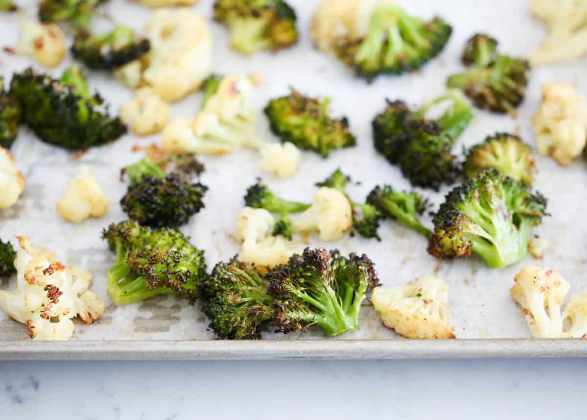 roasted broccoli and cauliflower on baking sheet