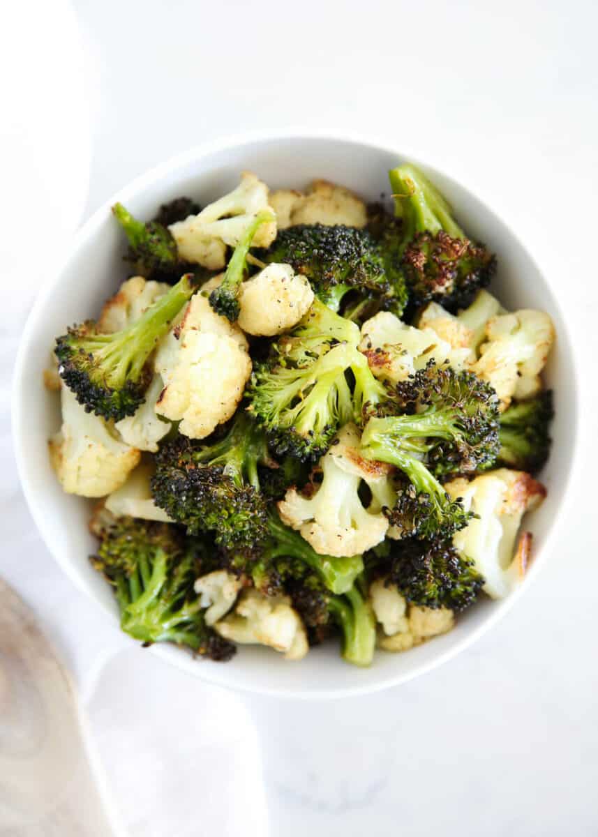 roasted broccoli and cauliflower in a white bowl