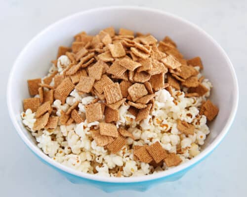 popcorn and golden grahams in bowl