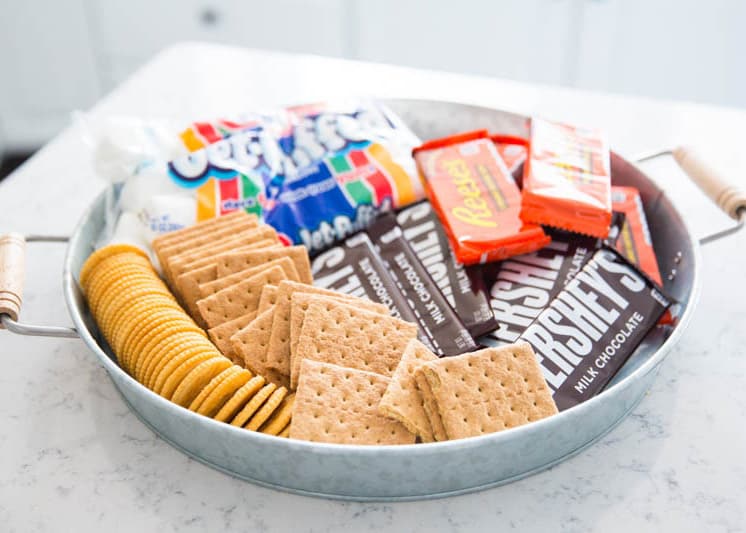 Silver tray with s'mores board ingredients.