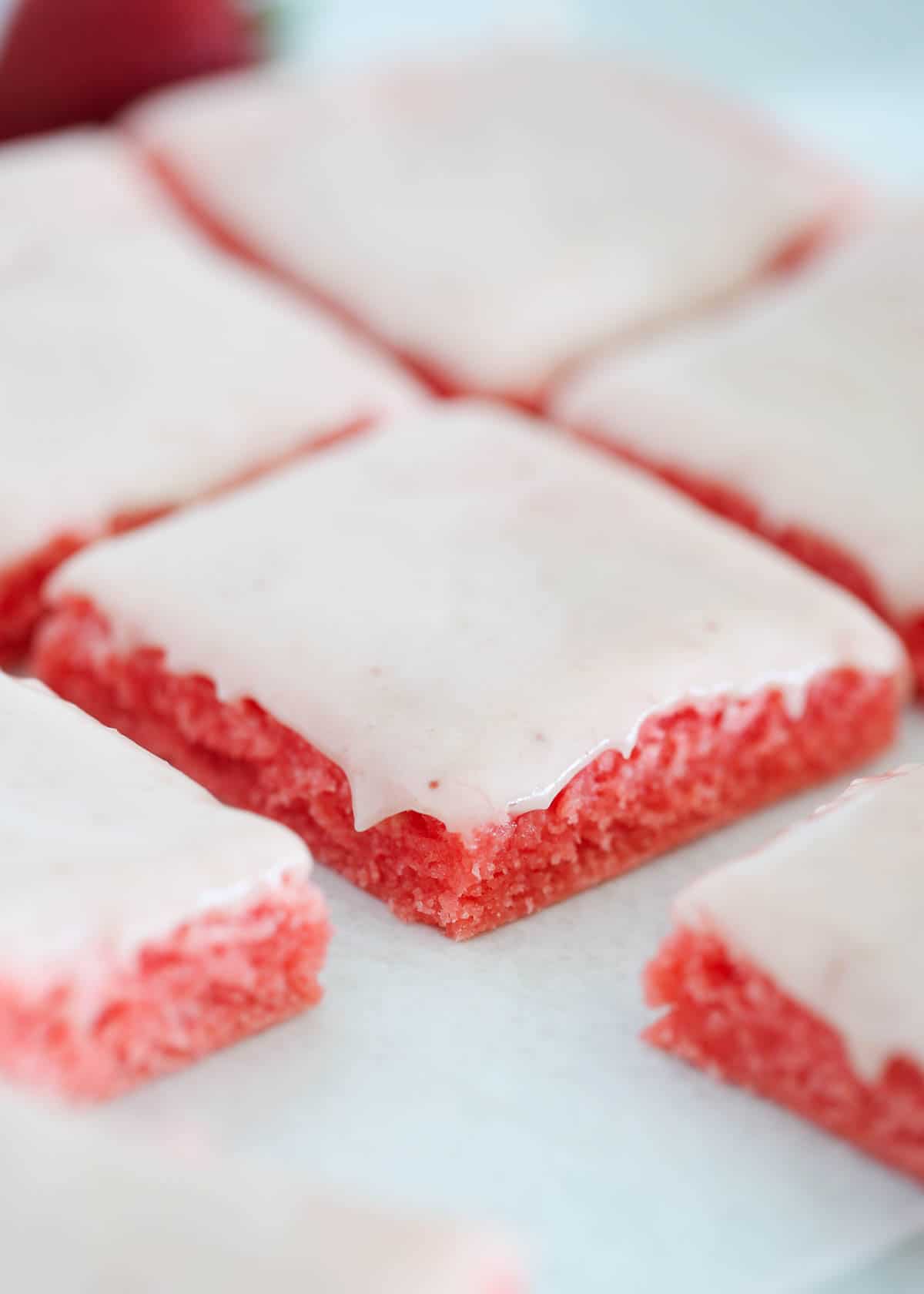 Sliced strawberry brownie with strawberry glaze. 