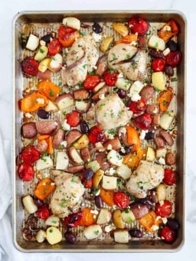 greek chicken and vegetables cooked on sheet pan