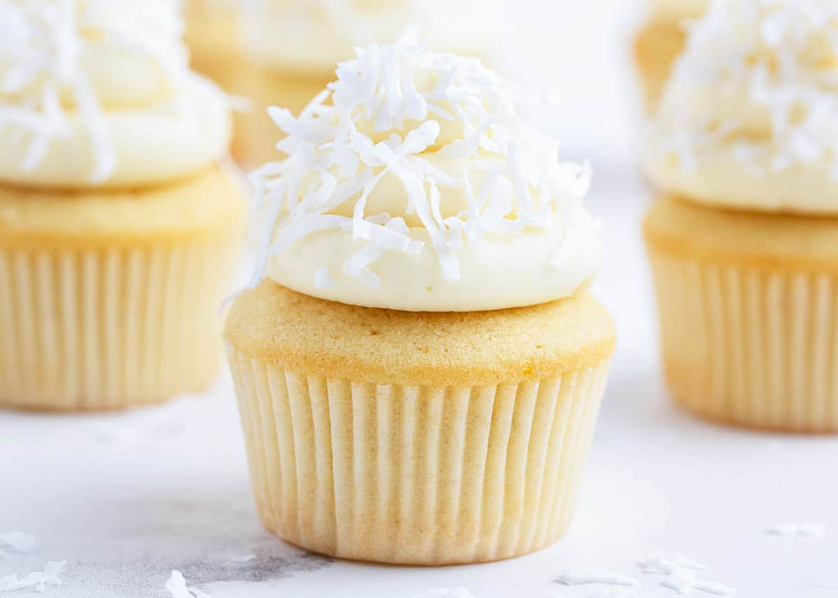 Coconut frosting frosted on a cupcake. 