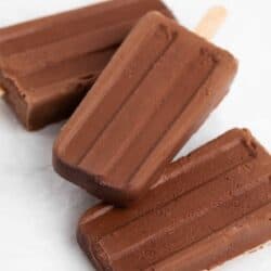 Fudge popsicles stacked on the table.