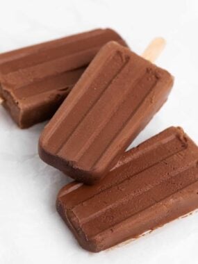 Fudge popsicles stacked on the table.