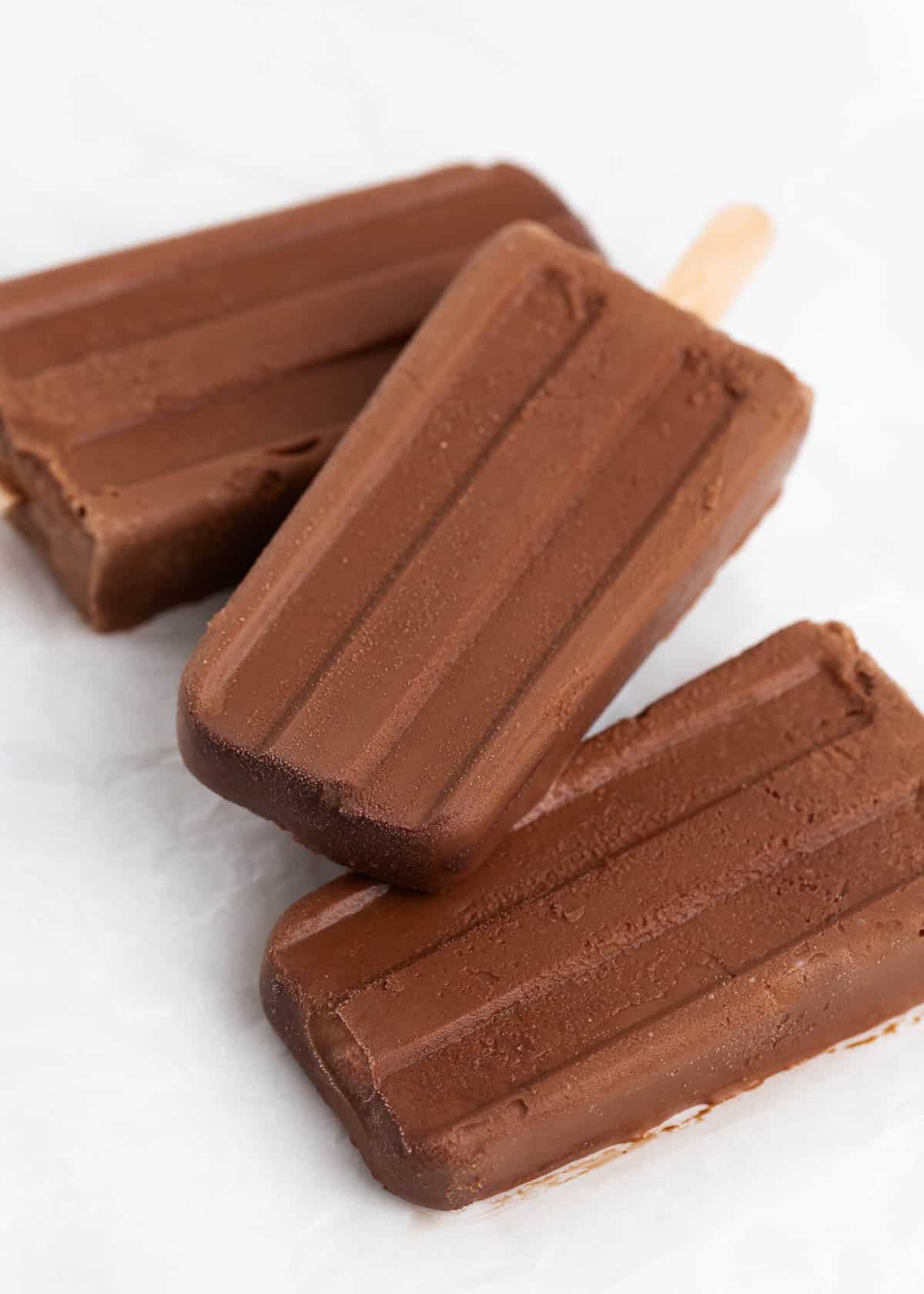 Fudge popsicles stacked on the table.