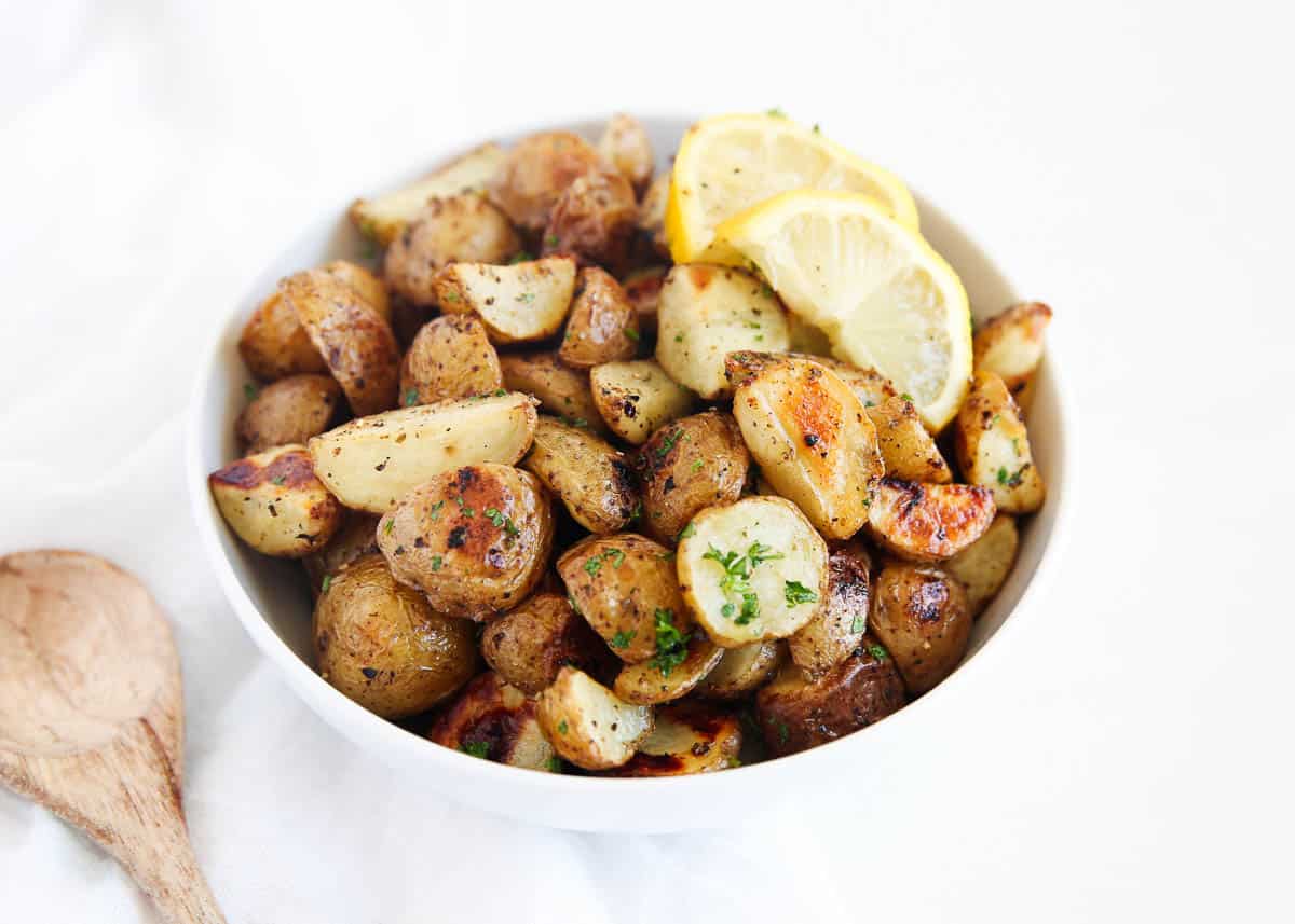 Greek potatoes in a white bowl.