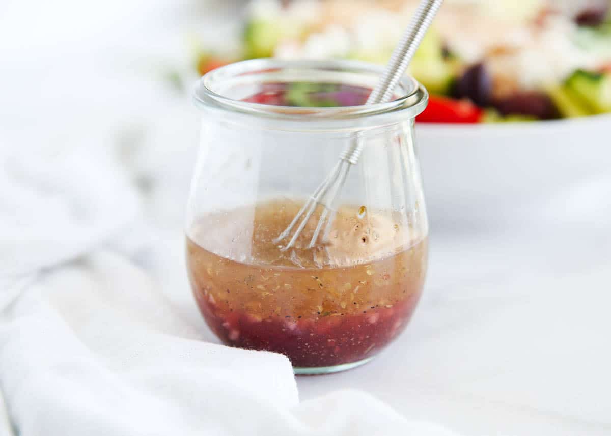 Greek salad dressing in a glass jar.