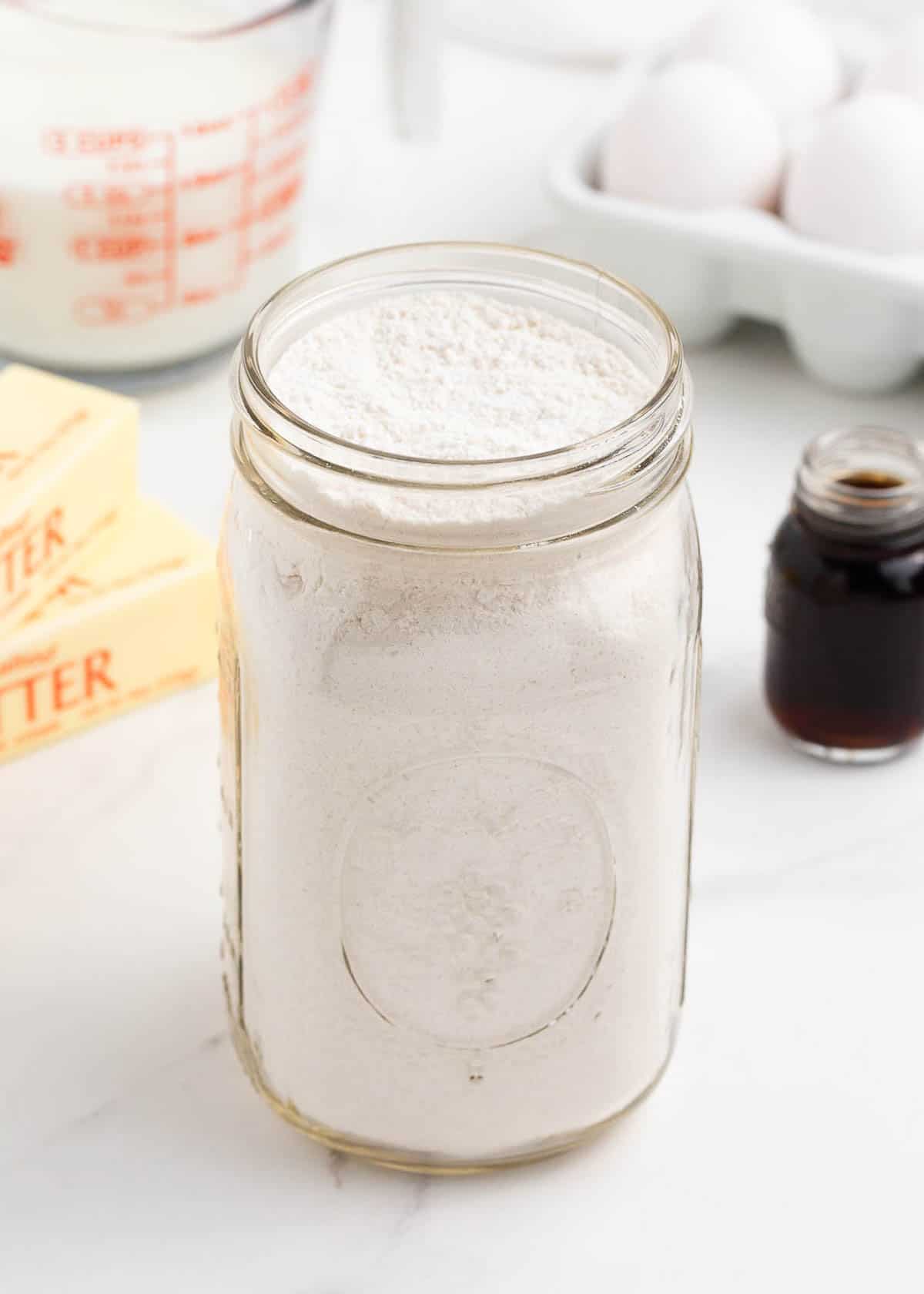 Homemade vanilla cake mix in a glass jar.