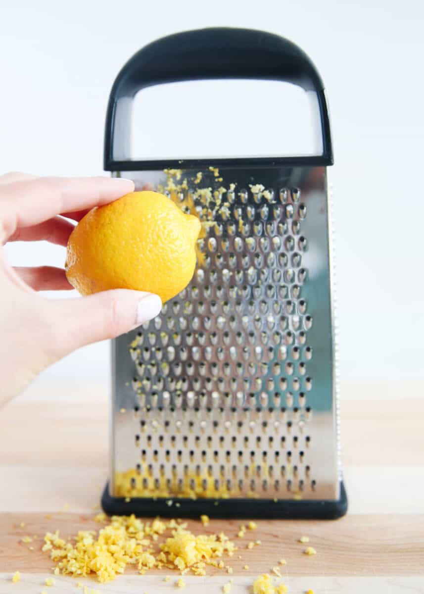 Zesting a lemon on a cheese grater.