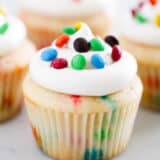 M&M cupcake with vanilla frosting.