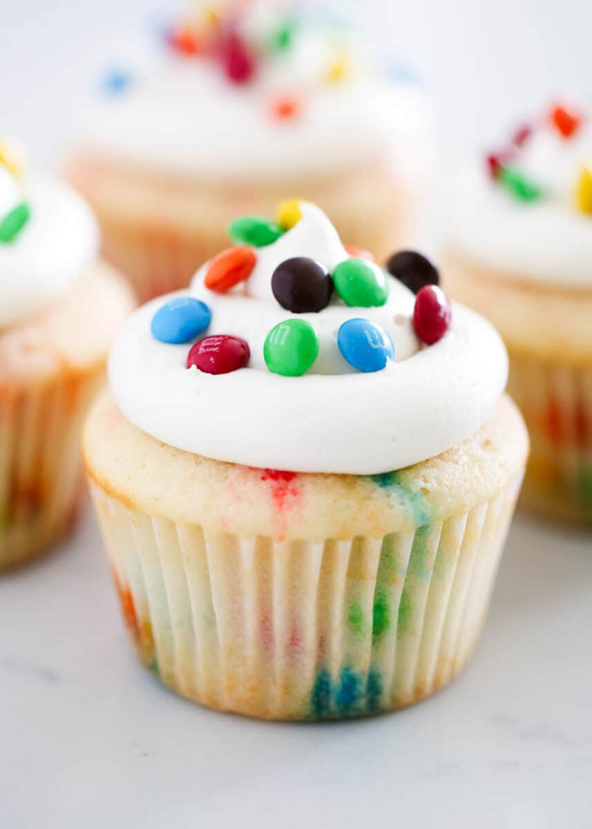 M&M cupcake with vanilla frosting.
