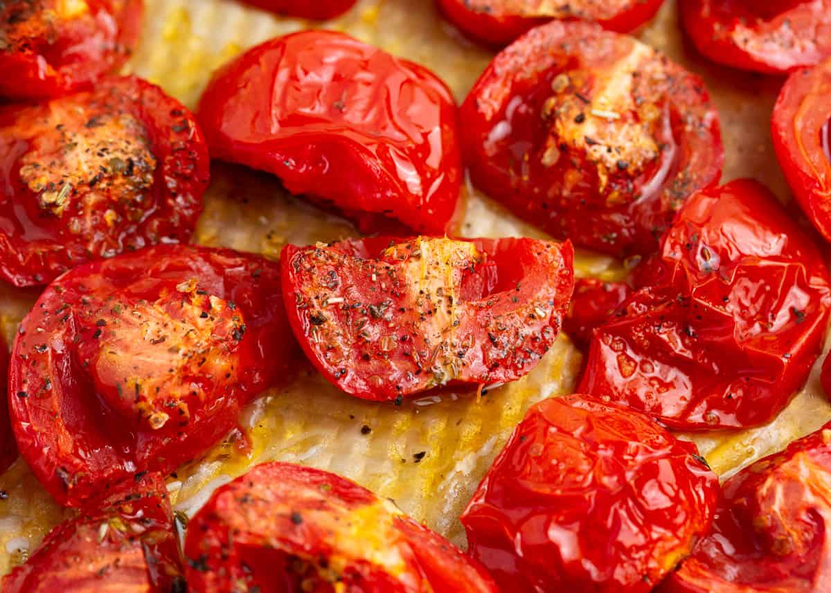 Roasted tomatoes on baking sheet.