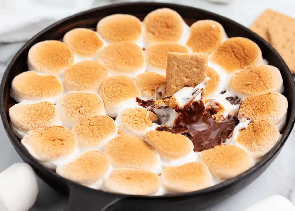 S'mores dip on countertop with graham crackers.