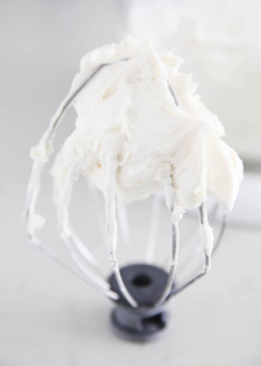 Vanilla frosting on a blender whisk.