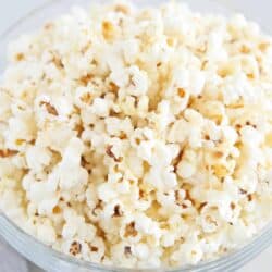 White cheddar popcorn in glass bowl.