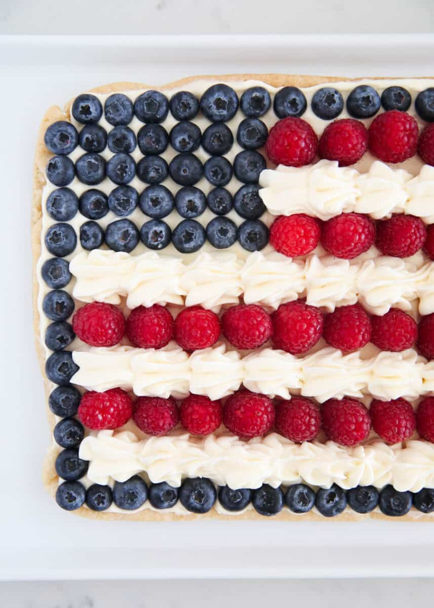 Flag fruit pizza on white plate.