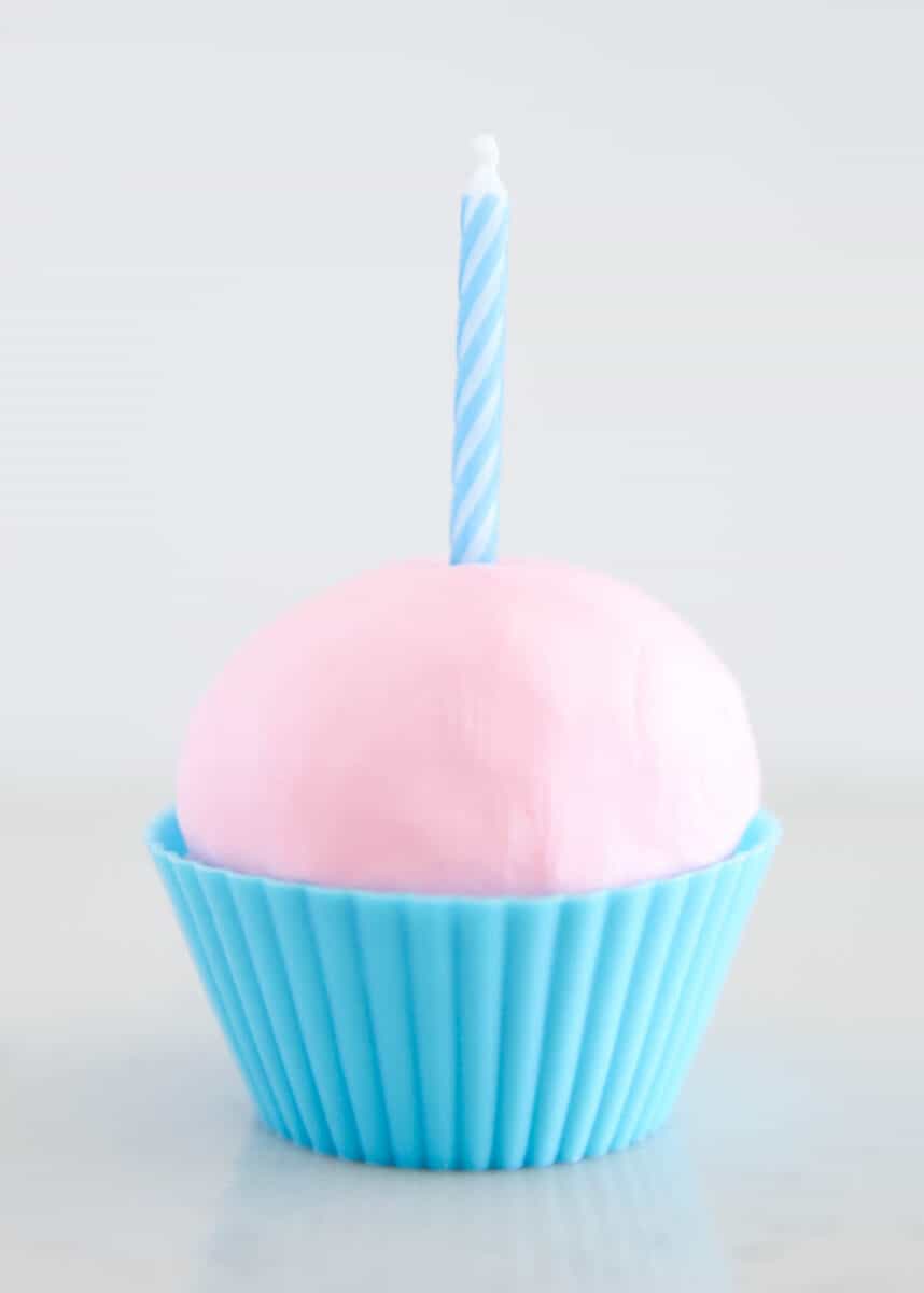 Edible playdough in cupcake liner with candle.