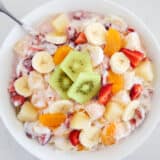 Hawaiian fruit salad in a large white bowl.