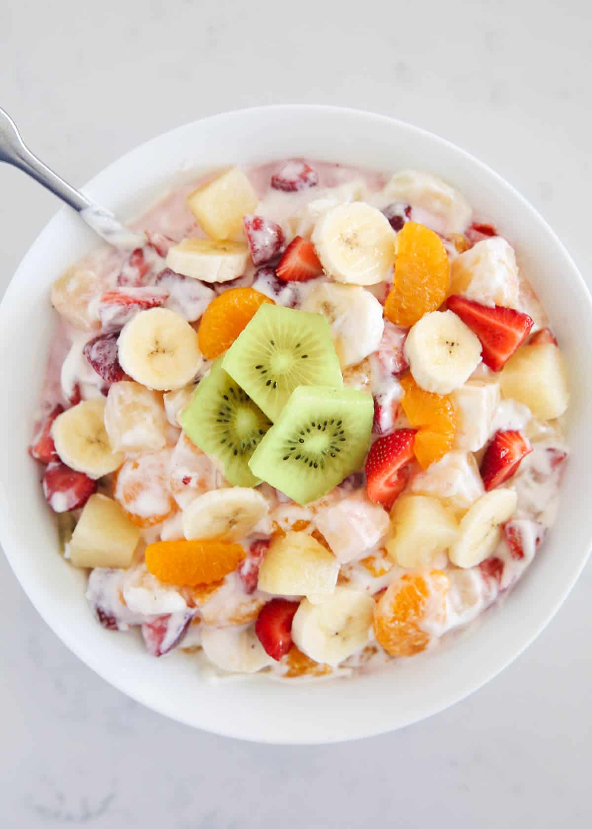 Hawaiian fruit salad in a large white bowl.