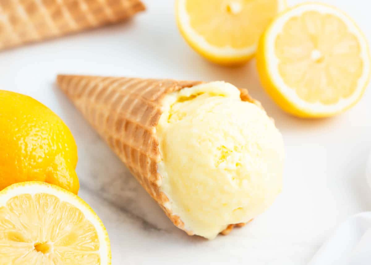 Lemon ice cream cone on counter.