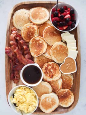 Pancake charcuterie board on marble counter.