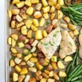 Sheet pan chicken and potatoes on counter.