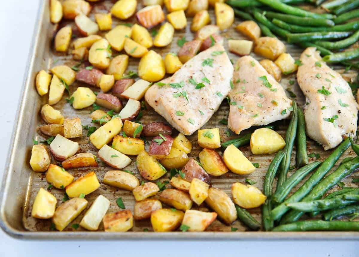 Sheet pan chicken and potatoes on the counter.