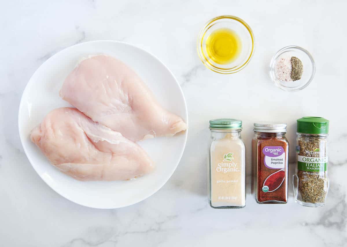 Baked chicken breast ingredients on counter.