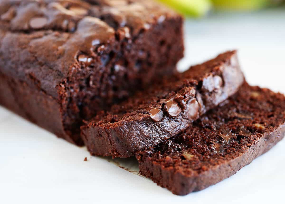 Sliced chocolate banana bread on counter.