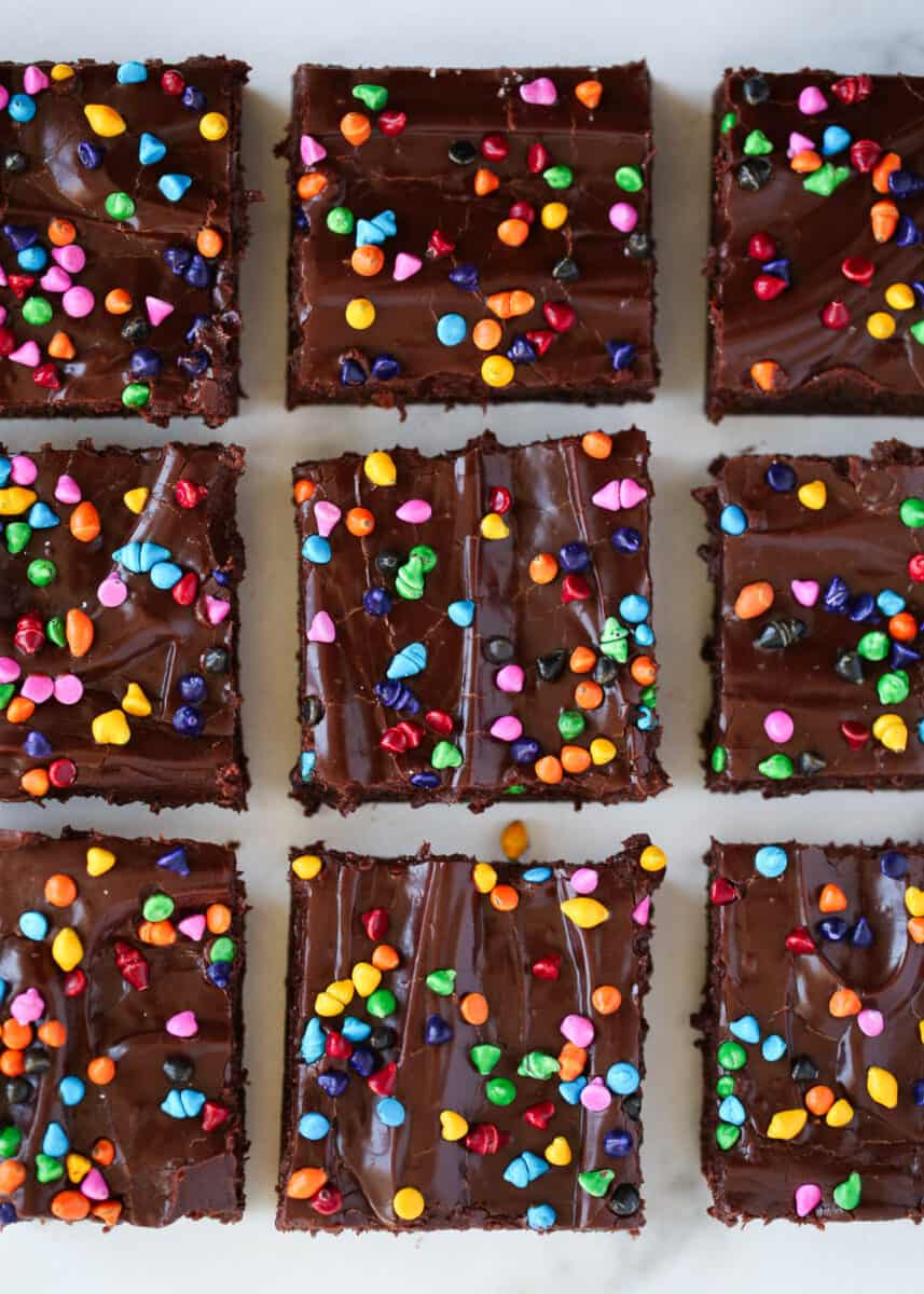 Sliced cosmic brownies on marble counter.