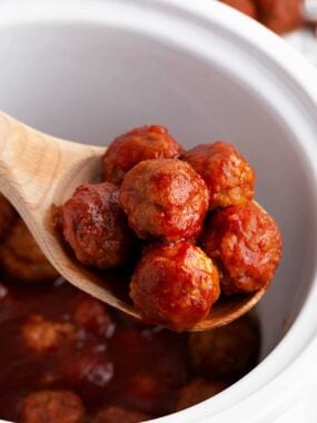 Spoonful of grape jelly chili sauce meatballs.
