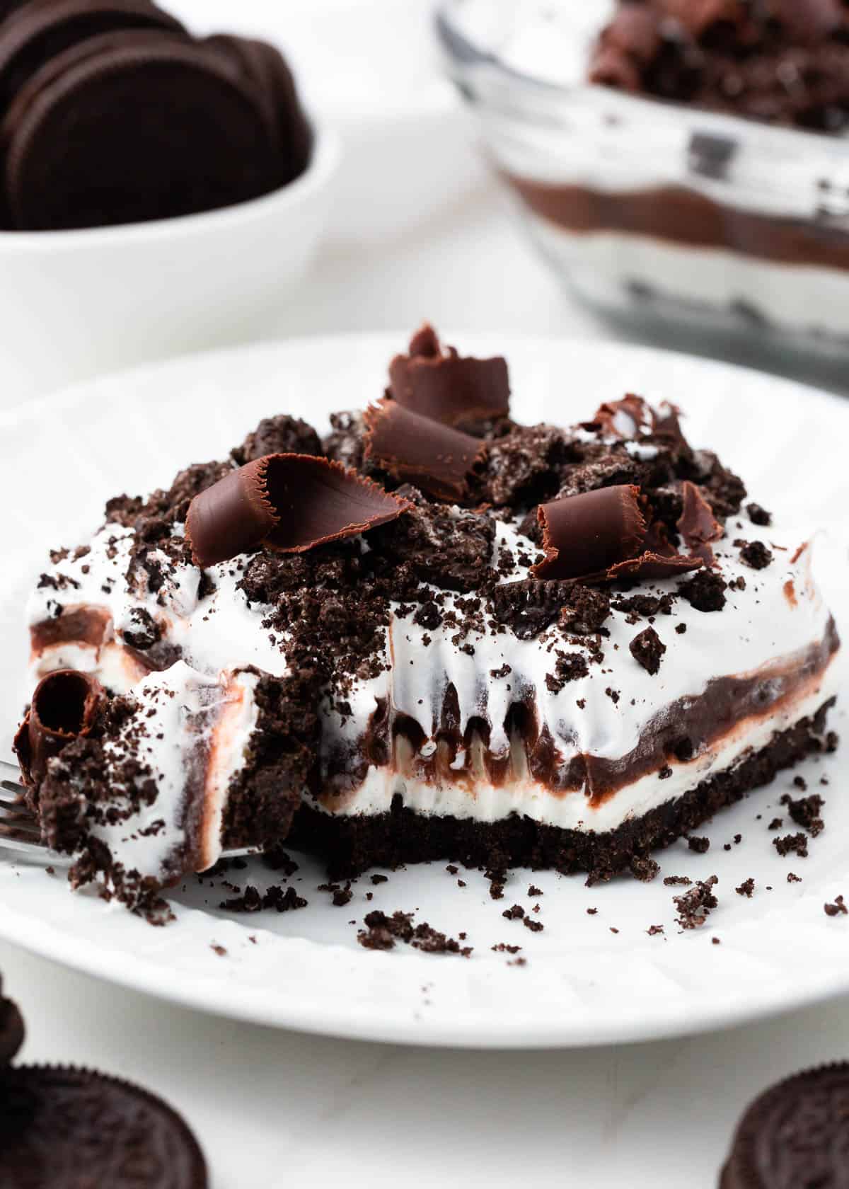 Chocolate lasagna on a white plate. 