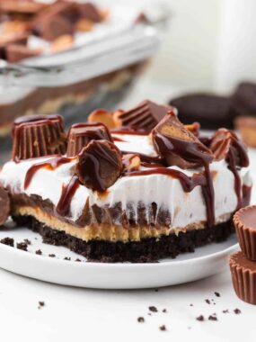 Slice of peanut butter lasagna on white plate.