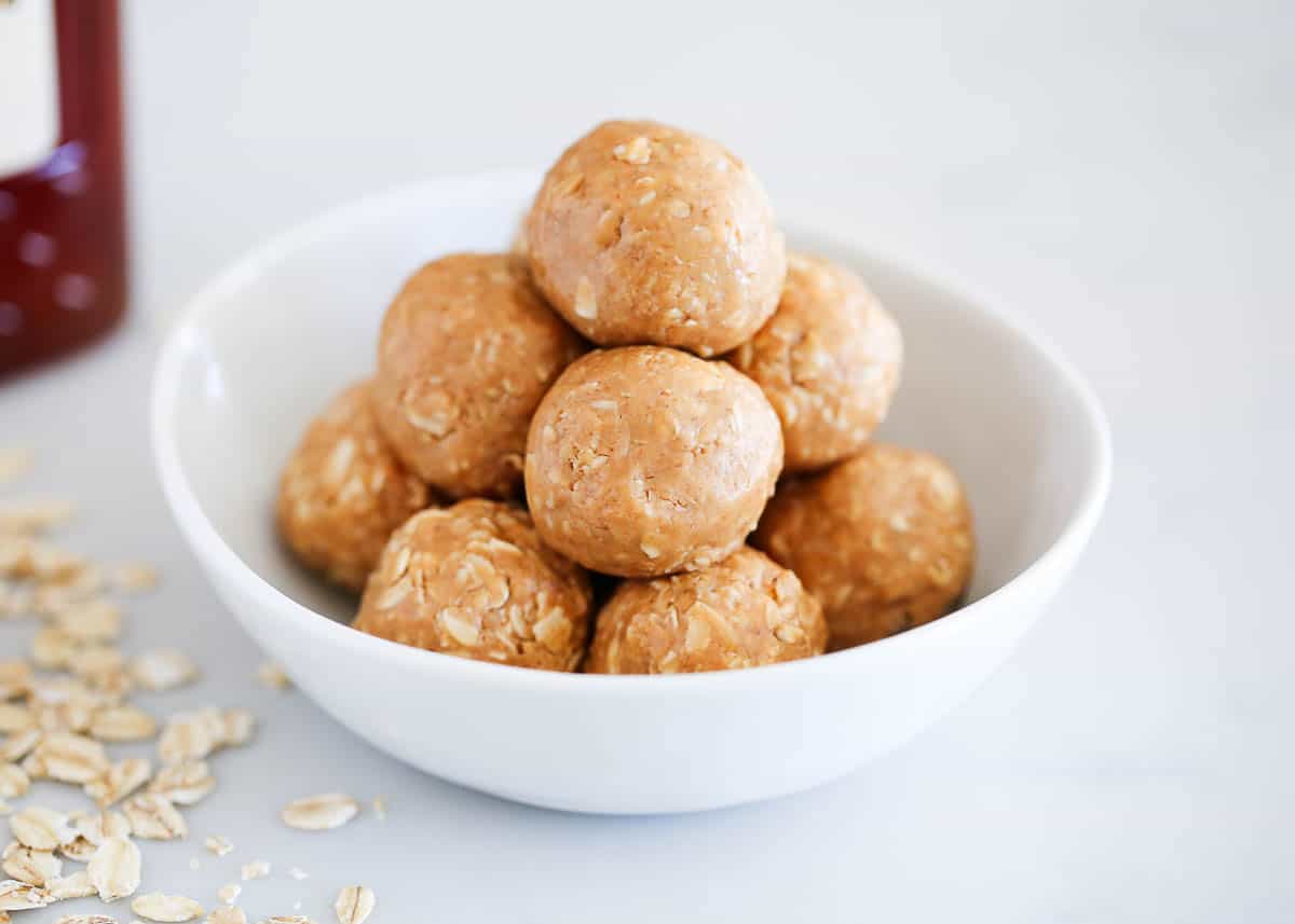 Peanut butter oatmeal balls in a white bowl.