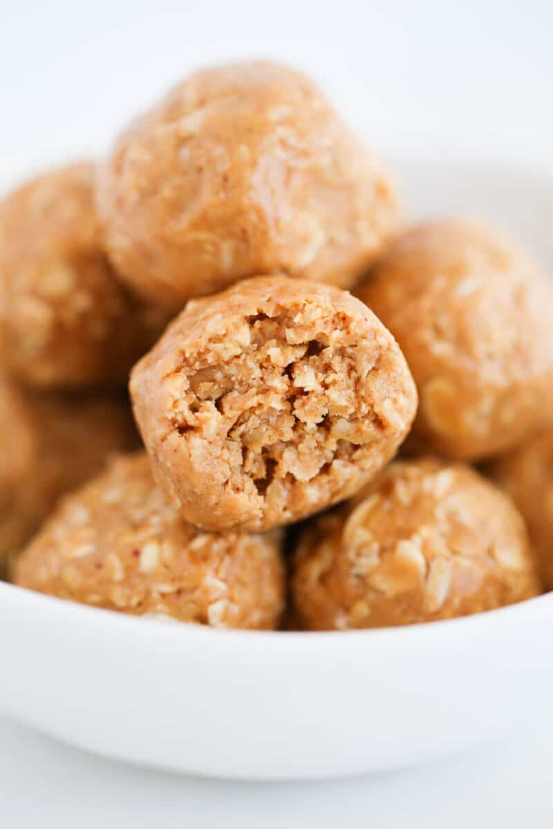 Peanut butter oatmeal balls with a bite taken.