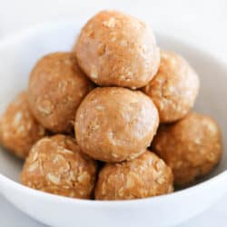 No bake peanut butter oatmeal balls in a white bowl.