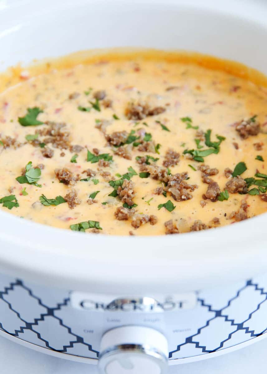 Sausage cheese dip cooking in a crockpot.