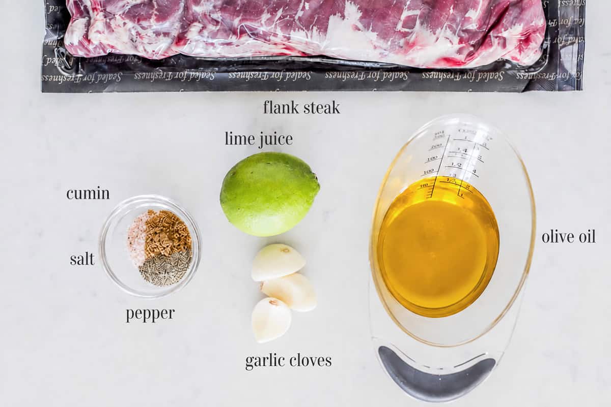 Flank steak taco ingredients on counter.