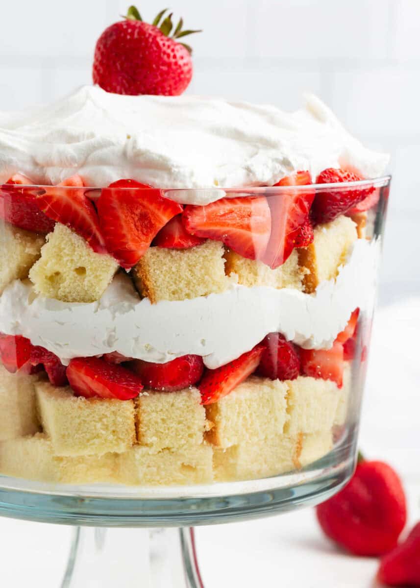 Strawberry shortcake trifle with strawberry, pound cake and whipped cream.